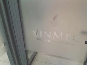 Logo of Vinmec International Hospital, hcmc (Saigon) on Frosted glass near the main entrance